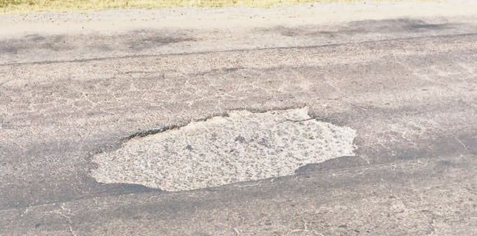 Locals go potty over potholes!