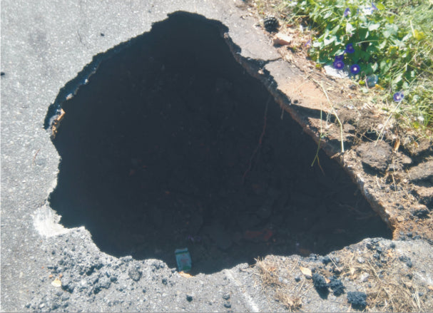 Another Erasmia sinkhole-truck almost swallowed